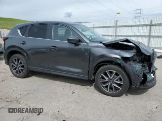 2018 Mazda CX-5 Touring z VIN JM3KFBCM2J0379190, wystawiony jako Copart lot #59233075 z przebiegiem 51 985 mil mil oraz Szkoda całkowita • Salvage title. Historia ofert i sprzedaży dostępna na DreamBid. Obrazek 4.