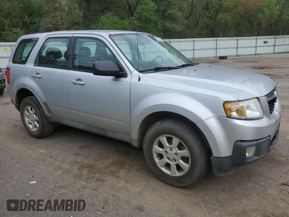 2011 Mazda Tribute Touring with VIN 4F2CY0C70BKM06723, listed as a Copart auction lot 80783624 with 218,372 mi miles and Salvage Title. Bid and sale history available at carsss.com. Image 4.