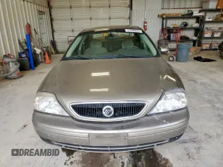 2002 Mercury Sable GS z VIN 1MEFM50U02G652804, wystawiony jako Copart lot #57405035 z przebiegiem 264 042 mil mil oraz Szkody całkowita. Historia ofert i sprzedaży dostępna na DreamBid. Obrazek 5.