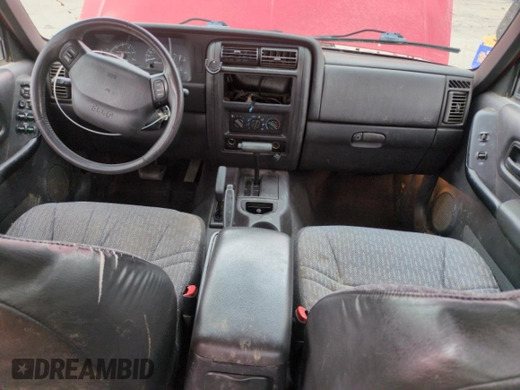 1999 Jeep Cherokee Sport with VIN 1J4FF68S2XL648735, listed as a Copart auction lot 58758115 with 252,248 mi miles and Salvage title. Bid and sale history available at DreamBid. Image 8.