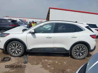 2020 Ford Escape Titanium Hybrid with VIN 1FMCU0DZ9LUA54867, listed as a IAAI auction lot 42268245 with 68,974 mi miles and . Bid and sale history available at DreamBid. Image 14.