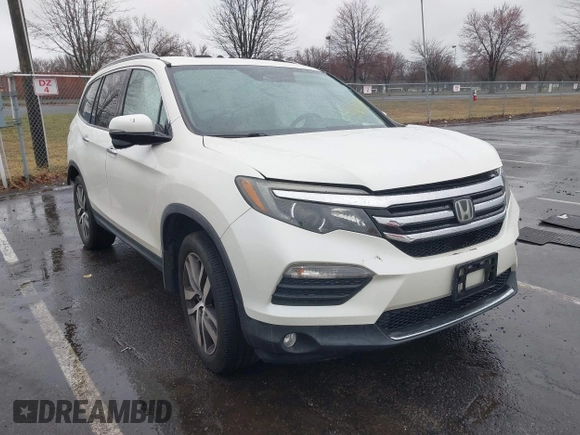 2016 Honda Pilot Touring with VIN 5FNYF6H95GB062089, listed as a IAAI auction lot 41810378 with 74,704 mi miles and . Bid and sale history available at DreamBid. Image 1.