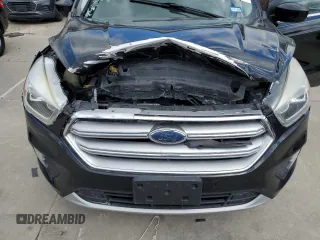 2017 Ford Escape SE z VIN 1FMCU0G93HUF10560, wystawiony jako Copart lot #57973915 z przebiegiem 127 444 mil mil oraz Czysty tytuł • Clean title. Historia ofert i sprzedaży dostępna na DreamBid. Obrazek 12.