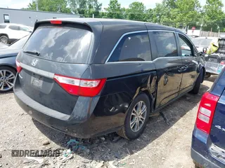 2011 Honda Odyssey EX-L with VIN 5FNRL5H62BB063125, listed as a IAAI auction lot 42562541 with 140,787 mi miles and . Bid and sale history available at DreamBid. Image 4.