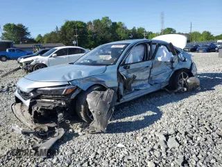 2023 Honda Civic Touring z VIN 2HGFE1F97PH305882, wystawiony jako Copart lot #54826915 z przebiegiem Nie podano mil oraz Szkody całkowita. Historia ofert i sprzedaży dostępna na DreamBid. Obrazek 1.