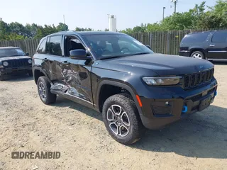 2024 Jeep Grand Cherokee Trailhawk with VIN 1C4RJYC68R8957042, listed as a IAAI auction lot 42423354 with 7,442 mi miles and . Bid and sale history available at DreamBid. Image 1.