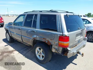1998 Jeep Grand Cherokee Limited z VIN 1J4GZ88Z4WC328450, wystawiony jako IAAI lot #42652126 z przebiegiem 166 576 mil mil oraz . Historia ofert i sprzedaży dostępna na DreamBid. Obrazek 3.