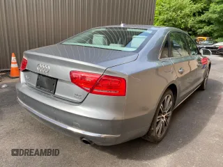 2011 Audi A8 with VIN WAURVAFD7BN018734, listed as a Copart auction lot 63735055 with 79,694 mi miles and Clean title. Bid and sale history available at DreamBid. Image 4.