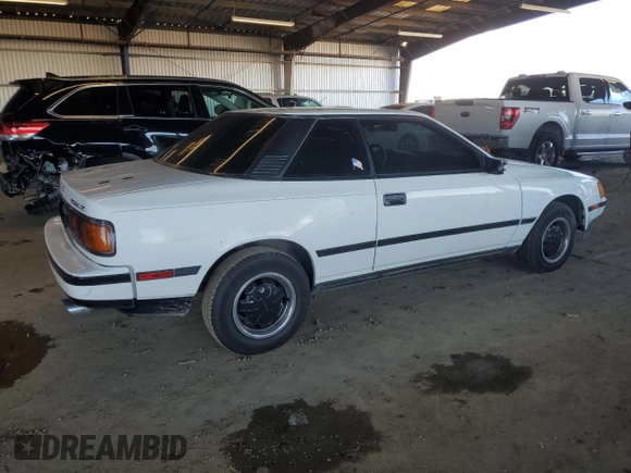 1986 Toyota Celica z VIN JT2ST64CXG7013064, wystawiony jako Copart lot #44228575 z przebiegiem 101 881 mil mil oraz Szkoda całkowita • Salvage title. Historia ofert i sprzedaży dostępna na DreamBid. Obrazek 3.