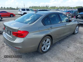 2016 BMW 3 Series 328i xDrive with VIN WBA8E3G5XGNU05817, listed as a IAAI auction lot 41942151 with 115,637 mi miles. Bid and sale history available at carsss.com. Image 4.