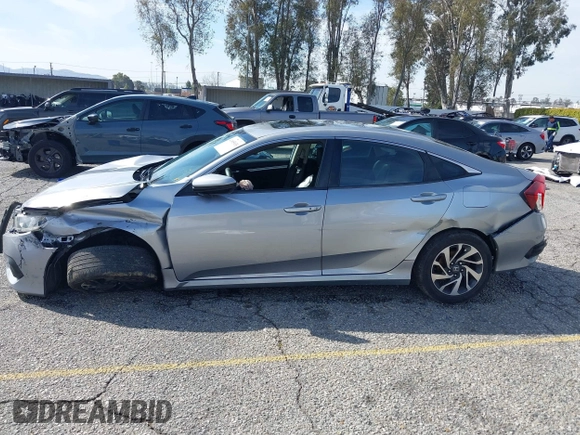 2016 Honda Civic Sedan EX with VIN 2HGFC2F74GH563268, listed as a IAAI auction lot 41805038 with 125,577 mi miles. Bid and sale history available at carsss.com. Image 14.