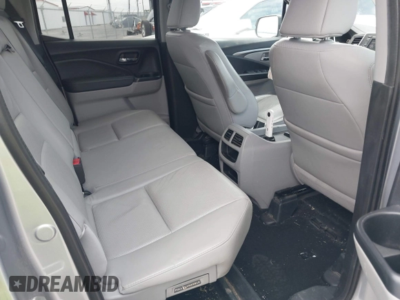2019 Honda Ridgeline RTL with VIN 5FPYK2F50KB004055, listed as a IAAI auction lot 41576975 with 128,620 mi miles and . Bid and sale history available at DreamBid. Image 8.
