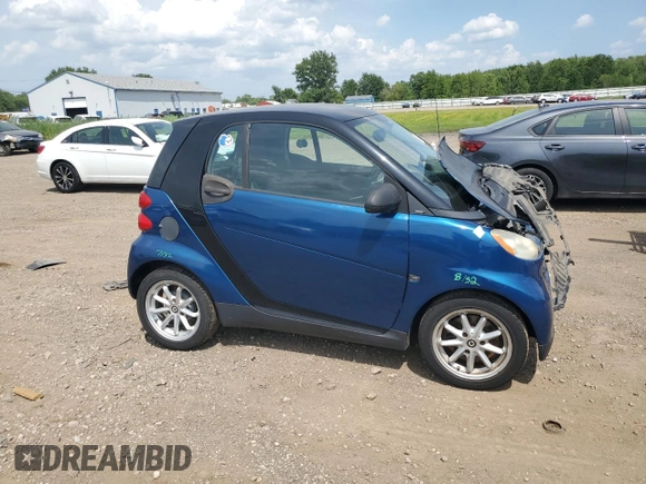2009 Smart fortwo Pure with VIN WMEEJ31X59K218003, listed as a Copart auction lot 62413775 with 82,711 mi miles and Salvage title. Bid and sale history available at DreamBid. Image 4.