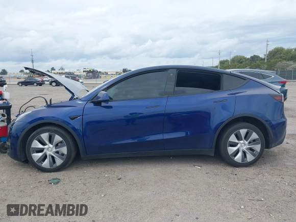 2022 Tesla Model Y Long Range z VIN 7SAYGDEE9NA002493, wystawiony jako IAAI lot #41756460 z przebiegiem 68 315 mil mil oraz . Historia ofert i sprzedaży dostępna na DreamBid. Obrazek 13.