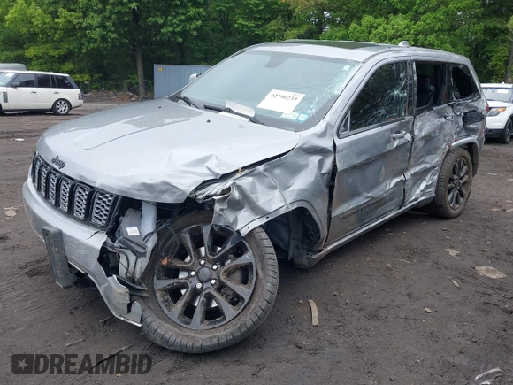 2019 Jeep Grand Cherokee Laredo E with VIN 1C4RJFAG5KC567003, listed as a IAAI auction lot 42390239 with 82,505 mi miles and . Bid and sale history available at DreamBid. Image 6.