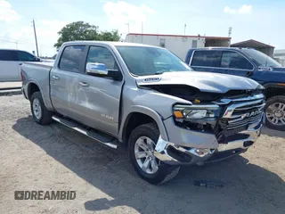 2021 Ram 1500 Laramie with VIN 1C6SRFJT1MN719168, listed as a IAAI auction lot 42326420 with 96,229 mi miles and . Bid and sale history available at DreamBid. Image 1.