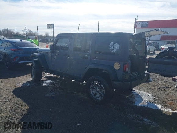 2015 Jeep Wrangler Unlimited Willys Wheeler with VIN 1C4BJWDG4FL589822, listed as a IAAI auction lot 41732614 with 149,112 mi miles and . Bid and sale history available at DreamBid. Image 3.