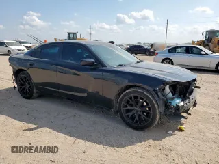 2015 Dodge Charger SXT with VIN 2C3CDXHG7FH721825, listed as a Copart auction lot 58076255 with 193,740 mi miles and Salvage title. Bid and sale history available at DreamBid. Image 4.