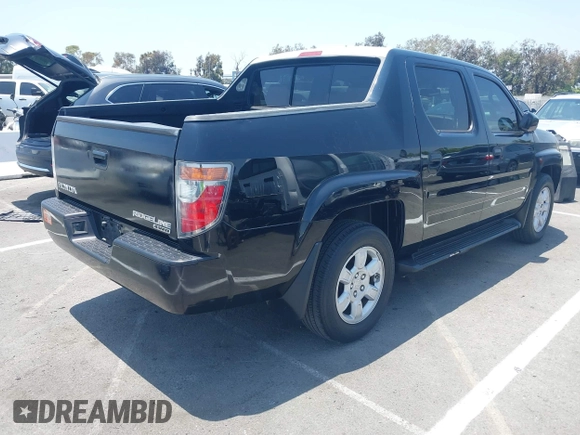 2006 Honda Ridgeline RTL with VIN 2HJYK16576H566002, listed as a IAAI auction lot 42595698 with 212,637 mi miles and . Bid and sale history available at DreamBid. Image 4.