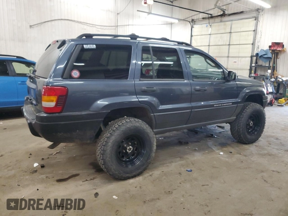 2004 Jeep Grand Cherokee Laredo with VIN 1J4GW48S24C294185, listed as a Copart auction lot 53357945 with 209,169 mi miles and Clean Title. Bid and sale history available at carsss.com. Image 3.