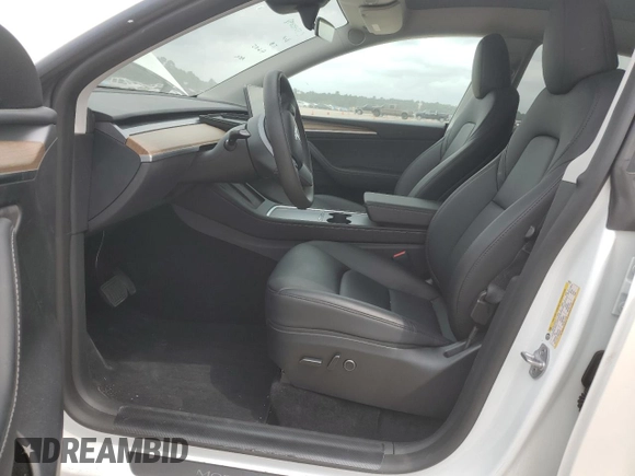 2023 Tesla Model Y Long Range z VIN 7SAYGDEE0PF802511, wystawiony jako Copart lot #54959415 z przebiegiem 12 902 mil mil oraz Szkoda całkowita • Salvage title. Historia ofert i sprzedaży dostępna na DreamBid. Obrazek 7.
