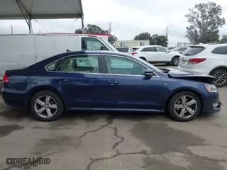 2015 Volkswagen Passat 1.8T Wolfsburg Ed with VIN 1VWAT7A32FC097106, listed as a IAAI auction lot 41913707 with 185,698 mi miles. Bid and sale history available at carsss.com. Image 13.