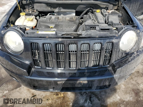 2010 Jeep Compass Sport with VIN 1J4NF4FB2AD591523, listed as a Copart auction lot 48809775 with 105,720 mi miles and Salvage Title. Bid and sale history available at carsss.com. Image 12.
