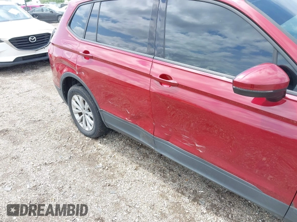 2018 Volkswagen Tiguan S with VIN 3VV1B7AX3JM045193, listed as a IAAI auction lot 42311886 with 69,049 mi miles and . Bid and sale history available at DreamBid. Image 6.