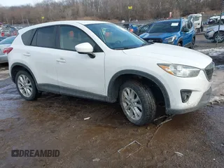 2014 Mazda CX-5 Grand Touring with VIN JM3KE4DY9E0300491, listed as a IAAI auction lot 41657153 with 157,394 mi miles and . Bid and sale history available at DreamBid. Image 1.