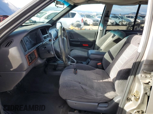 1998 Jeep Grand Cherokee Laredo with VIN 1J4GZ58S7WC316522, listed as a Copart auction lot 80201994 with 217,465 mi miles and Clean Title. Bid and sale history available at carsss.com. Image 7.