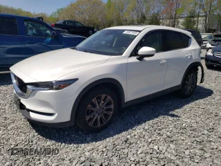 2019 Mazda CX-5 Grand Touring with VIN JM3KFBDM0K0592087, listed as a Copart auction lot 54921555 with 70,598 mi miles and Salvage title. Bid and sale history available at DreamBid. Image 1.
