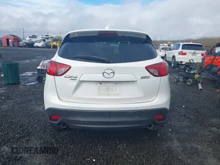 2015 Mazda CX-5 Grand Touring with VIN JM3KE4DY0F0483037, listed as a IAAI auction lot 41578222 with 102,988 mi miles. Bid and sale history available at carsss.com. Image 16.