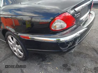 2004 Jaguar X-Type with VIN SAJEA51C44WD56659, listed as a IAAI auction lot 41712395 with Not Provided miles and . Bid and sale history available at DreamBid. Image 6.