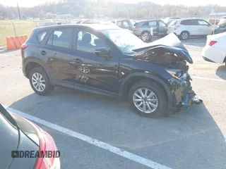 2015 Mazda CX-5 Sport z VIN JM3KE2BE8F0475717, wystawiony jako IAAI lot #40989102 z przebiegiem Nie podano mil oraz . Historia ofert i sprzedaży dostępna na DreamBid. Obrazek 1.