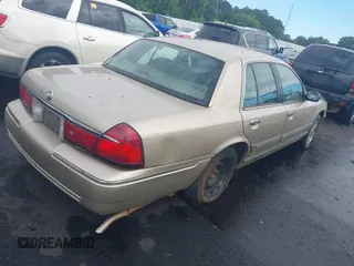 1999 Mercury Grand Marquis GS z VIN 2MEFM74W4XX645430, wystawiony jako IAAI lot #42154522 z przebiegiem 152 306 mil mil oraz . Historia ofert i sprzedaży dostępna na DreamBid. Obrazek 4.