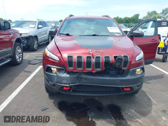 2014 Jeep Cherokee Trailhawk with VIN 1C4PJMBS7EW162357, listed as a IAAI auction lot 42601903 with 104,768 mi miles and . Bid and sale history available at DreamBid. Image 6.