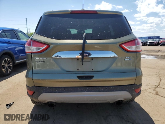 2013 Ford Escape SEL z VIN 1FMCU9H93DUD67848, wystawiony jako Copart lot #57221755 z przebiegiem 129 671 mil mil oraz Czysty tytuł • Clean title. Historia ofert i sprzedaży dostępna na DreamBid. Obrazek 6.