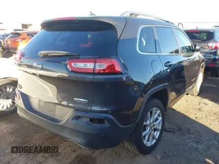 2016 Jeep Cherokee Altitude with VIN 1C4PJLCS8GW173279, listed as a IAAI auction lot 41129117 with 163,978 mi miles. Bid and sale history available at carsss.com. Image 4.