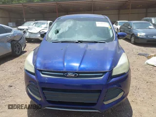 2014 Ford Escape SE z VIN 1FMCU9GX6EUD67330, wystawiony jako IAAI lot #42705724 z przebiegiem 171 996 mil mil oraz . Historia ofert i sprzedaży dostępna na DreamBid. Obrazek 6.
