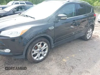 2014 Ford Escape Titanium with VIN 1FMCU0JX1EUD71953, listed as a IAAI auction lot 42036023 with 165,624 mi miles. Bid and sale history available at carsss.com. Image 6.