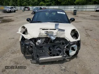 2014 MINI Coupe S z VIN WMWSX3C5XET409347, wystawiony jako Copart lot #56321384 z przebiegiem 81 070 mil mil oraz Szkody całkowita. Historia ofert i sprzedaży dostępna na DreamBid. Obrazek 5.