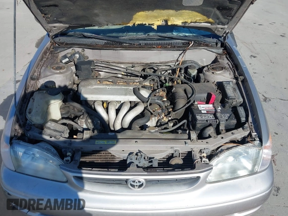 1999 Toyota Corolla VE z VIN 1NXBR18E6XZ225512, wystawiony jako IAAI lot #41842023 z przebiegiem 324 718 mil mil oraz . Historia ofert i sprzedaży dostępna na DreamBid. Obrazek 10.