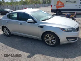 2012 Kia Optima EX z VIN 5XXGN4A77CG043921, wystawiony jako IAAI lot #42124766 z przebiegiem 145 915 mil mil oraz . Historia ofert i sprzedaży dostępna na DreamBid. Obrazek 1.