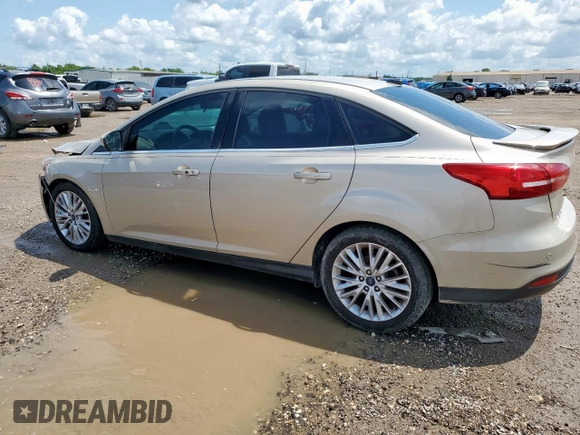 2018 Ford Focus Titanium z VIN 1FADP3J26JL279443, wystawiony jako Copart lot #58837435 z przebiegiem 136 538 mil mil oraz Szkoda całkowita • Salvage title. Historia ofert i sprzedaży dostępna na DreamBid. Obrazek 2.