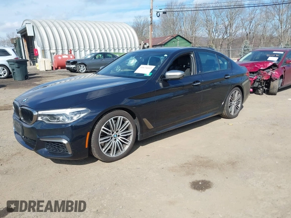 2018 BMW 5 Series M550i xDrive with VIN WBAJB9C52JB035930, listed as a IAAI auction lot 41674415 with 56,294 mi miles and . Bid and sale history available at DreamBid. Image 17.