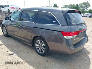 2014 Honda Odyssey Touring with VIN 5FNRL5H99EB138952, listed as a IAAI auction lot 42538833 with 146,959 mi miles and . Bid and sale history available at DreamBid. Image 3.