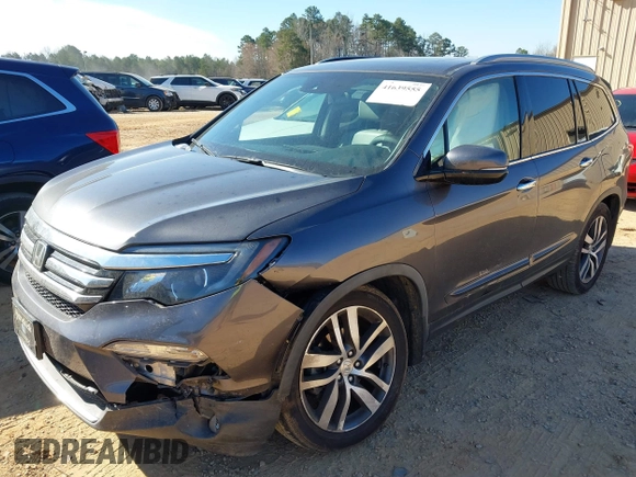 2017 Honda Pilot Touring with VIN 5FNYF5H92HB038893, listed as a IAAI auction lot 41639555 with 100,354 mi miles. Bid and sale history available at carsss.com. Image 17.