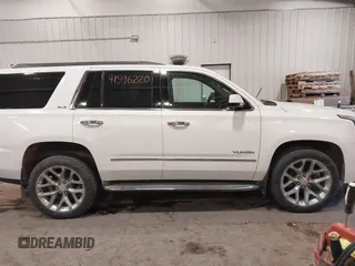 2015 GMC Yukon SLE with VIN 1GKS2AKC6FR103447, listed as a IAAI auction lot 41596220 with 104,209 mi miles. Bid and sale history available at carsss.com. Image 13.
