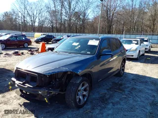 2014 BMW X1 sDrive28i with VIN WBAVM1C51EVW49093, listed as a IAAI auction lot 41500647 with 111,036 mi miles. Bid and sale history available at carsss.com. Image 2.