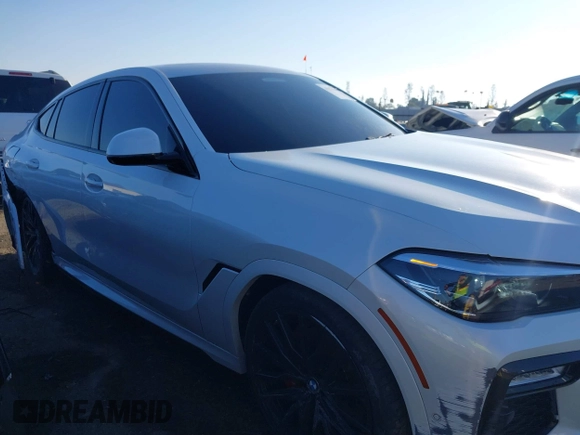 2021 BMW X6 sDrive40i z VIN 5UXCY4C06M9E16162, wystawiony jako IAAI lot #41279040 z przebiegiem 94 494 mil mil oraz . Historia ofert i sprzedaży dostępna na DreamBid. Obrazek 13.